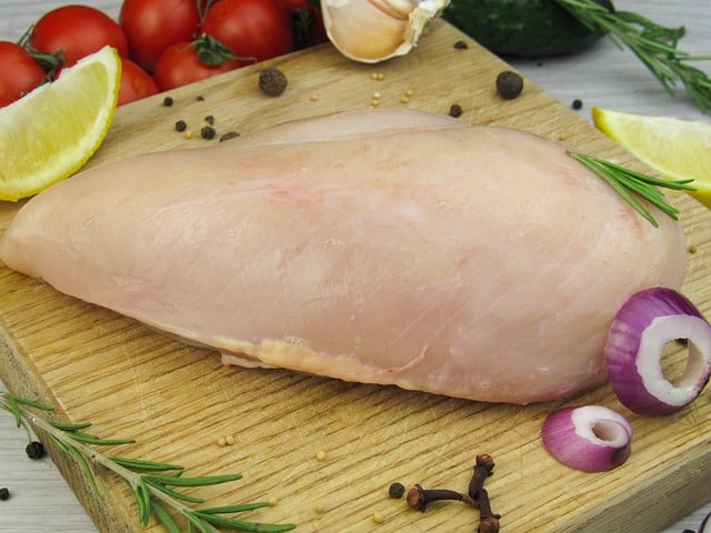 raw chicken breast with vegetables