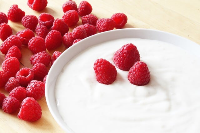 yogurt with raspberries in bowl