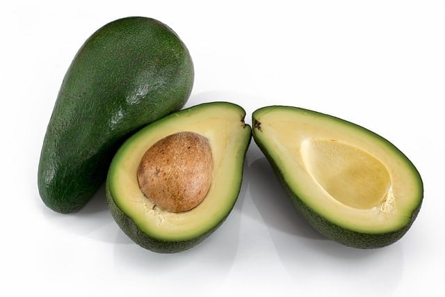 avocadoes in whole and cut open in half